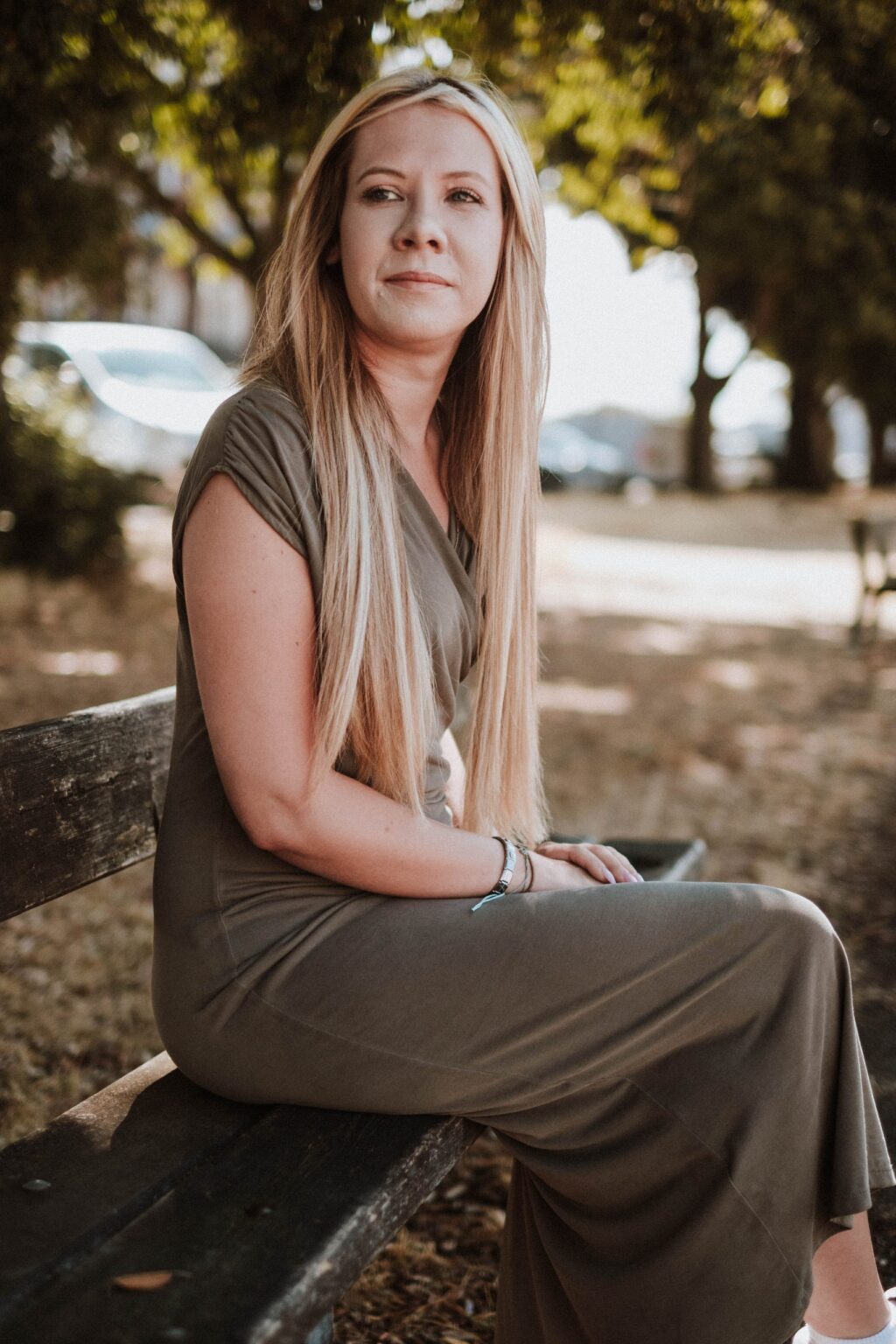 Danielle Hunter sitting on a park bench, smiling gently
